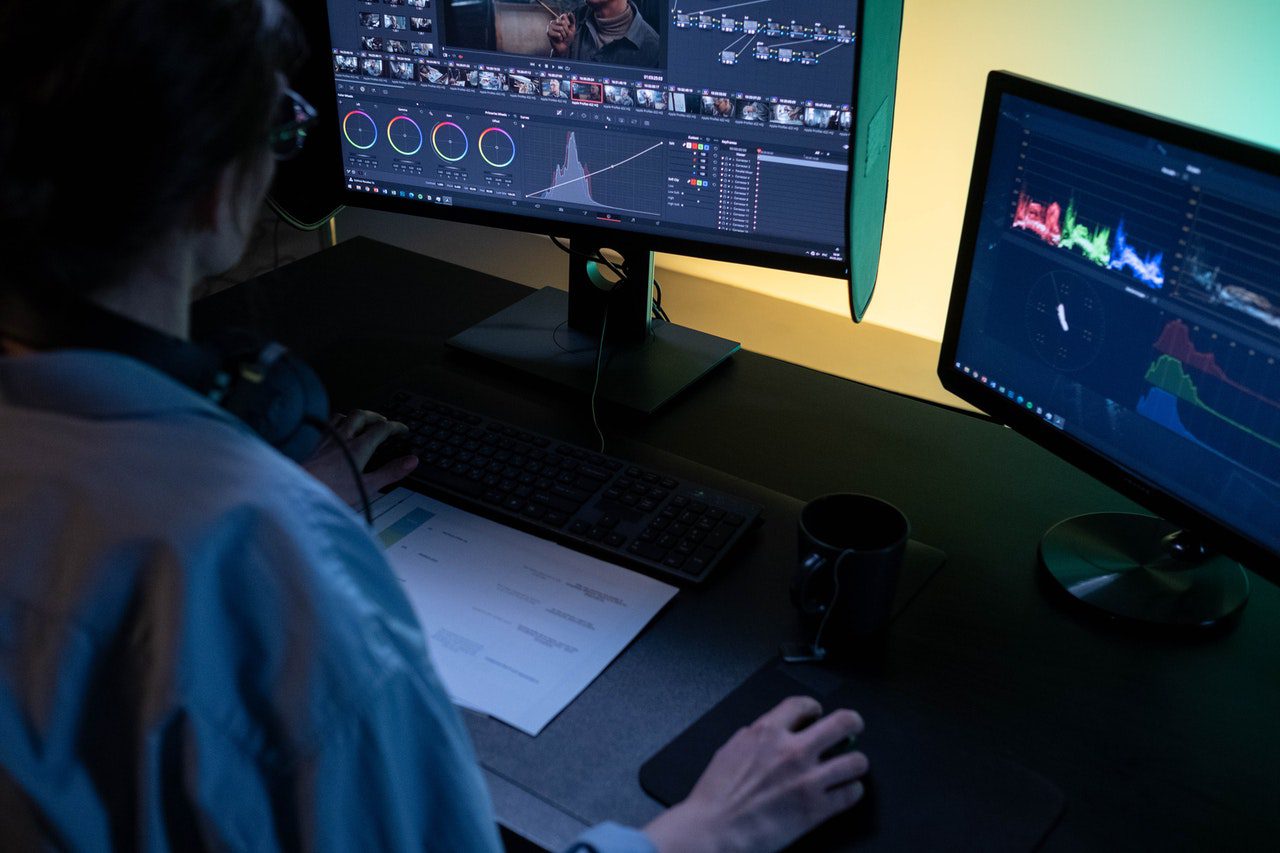 Girl using 4K monitor for editing video